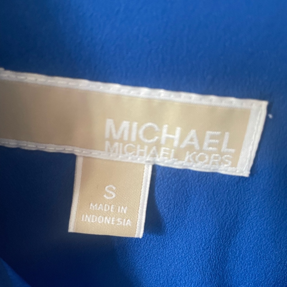 Michael Kors zip-up blouse. It has roll up sleeves or button long sleeve.